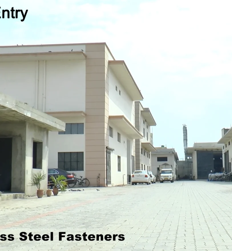 Manufacturing team reviewing stainless steel fasteners