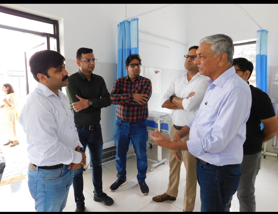 Factory leadership team walking through stainless steel fastener production